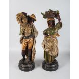 A SUPERB LARGE PAIR OF TERRACOTTA STANDING FIGURES OF A YOUNG MAN AND GIRL, carrying sheaths of corn