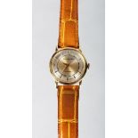 A GOOD 14K GOLD WITTNAUER AUTO WRISTWATCH with leather strap.