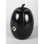 A WOODEN EBONISED MELON TEA CADDY. 7ins high.