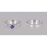 TWO WHITE GOLD RINGS, one set with tanzanite and diamond and a matching half eternity ring, 1CT