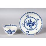 AN 18TH CENTURY WORCESTER TEA BOWL AND SAUCER printed in under-glaze blue with the Fruit and