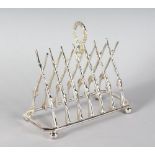 A SILVER PLATED CROSS GUNS TOAST RACK.