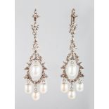 A PAIR OF 9CT GOLD AND SILVER PEARL SET DROP EARRINGS.