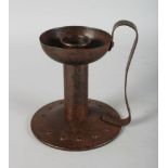 A "CHRISTOPHER DRESSER" METAL CANDLESTICK. 6.5ins high.