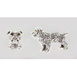 TWO SILVER DOG BROOCHES.