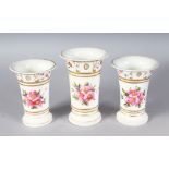 A 19TH CENTURY ENGLISH PORCELAIN GARNITURE OF SPILL VASES painted with dog roses, probably Spode.