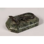 A BRONZE LIZARD on a marble base. 4.5ins long.