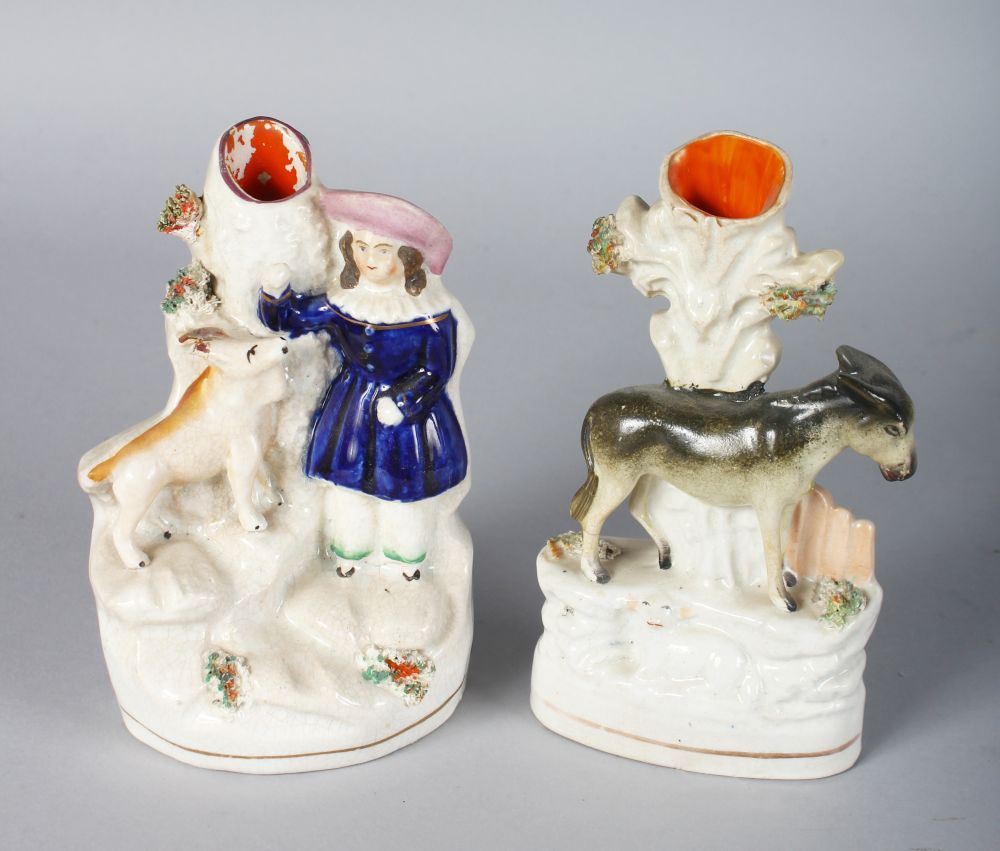 TWO STAFFORDSHIRE SPILL VASES, DONKEY BESIDE A TREE and YOUNG GIRL WITH DOG. 6ins high.