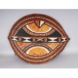 A LARGE AFRICAN ANIMAL SKIN SHIELD, with stylised painted decoration. 33ins x 23ins.