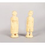 A MINIATURE PAIR OF EUROPEAN CARVED IVORY FIGURES OF A DUTCH MAN AND WOMAN. 3.5ins high.