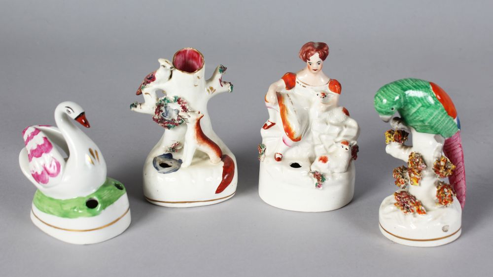 A SMALL STAFFORDSHIRE SPILL VASE FOX, A PEN HOLDER BIRD, A PEN HOLDER girl with lamb and A PARAKEET.