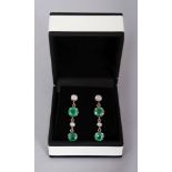 A PAIR OF WHITE GOLD, EMERALD AND DIAMOND DROP EARRINGS.