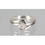 AN 18CT WHITE GOLD DIAMOND SET CROSSOVER RING.