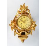 A FRENCH LOUIS XVI DESIGN CARTEL WALL CLOCK. 21ins long.