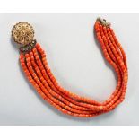 A GOOD FIVE ROW CORAL NECKLACE with 18CT GOLD CLASP, 118gms.