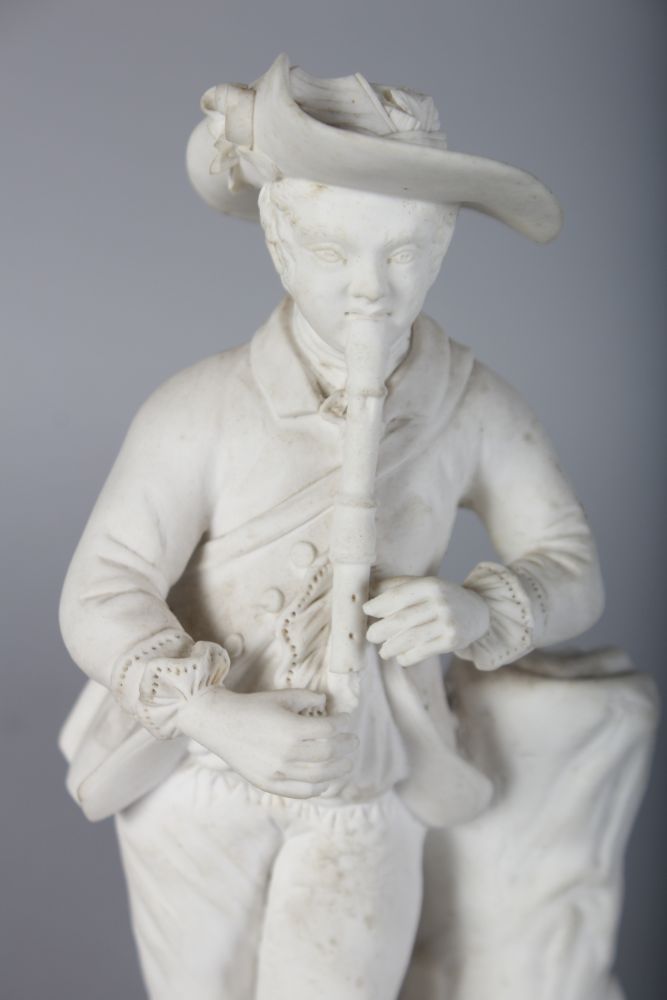 A 19TH CENTURY ROCKINGHAM FIGURE OF A BOY playing a pipe to his dog. - Image 2 of 5