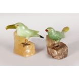 TWO GOOD "RUSSIAN" CARVED HARDSTONE BIRDS with coloured beaks, feathers and inset eyes, metal feet