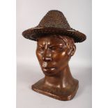 A LARGE 20TH CENTURY BRONZE BUST depicting a Nepalese man wearing a hat. 21ins high.