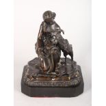 A SMALL RUSSIAN BRONZE, GIRL HOLDING A TAMBOURINE, a goat at her side. Signed in Cyrillic, on a