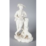 A 19TH CENTURY ROCKINGHAM FIGURE OF A BOY playing a pipe to his dog.