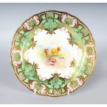 A ROYAL WORCESTER GOOD PLATE painted fruit under a heavily gilt and lime green border by A.