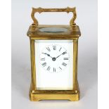 A 19TH CENTURY FRENCH BRASS CARRIAGE CLOCK. 4.5ins high.