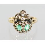 A 9CT GOLD, EMERALD AND DIAMOND SINGLE HEART RING.