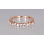 AN 18CT ROSE GOLD DIAMOND HALF ETERNITY RING of 1/2CT approx.