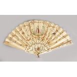 AN 18TH CENTURY FRENCH IVORY AND PAPER FAN.