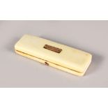 A GEORGIAN IVORY GOLD SET TOOTHPICK BOX.