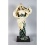 A CONTINENTAL POTTERY FIGURE OF A SEMI CLAD YOUNG LADY. 24ins high.