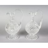A GOOD PAIR OF WATERFORD HOBNAIL CUT CLARET JUGS.