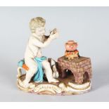 A SMALL MEISSEN GROUP "WINTER", a cupid beside a stove. Cross swords mark in blue. 4ins high.