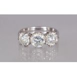 AN 18CT THREE STONE DIAMOND RING of 2.91CTS.