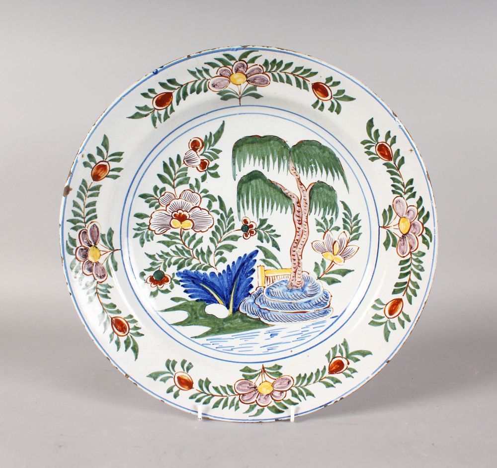 A DUTCH DELFT POLYCHROME CHARGER, CIRCA. 1740'S, marked AK for Antonius Kruisweg, possibly for the