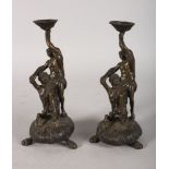 A PAIR OF BRONZE 19TH CENTURY CANDLESTICKS in the form of Hippocamps fish tailed horse (2). 7.5ins.