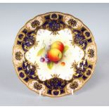 A ROYAL WORCESTER GOOD PLATE painted fruit under a heavily gilt and cobalt blue border by A.