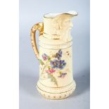 A ROYAL WORCESTER BLUSH IVORY JUG with bearded mask spout painted with flowers in the style of Raby,