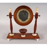 A GOOD 19TH CENTURY MAHOGANY TOILET MIRROR with alabaster feet and finials. 12ins wide.