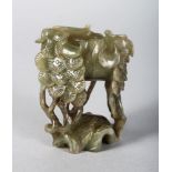 A CHINESE CARVED JADE LIBATION CUP. 3ins.