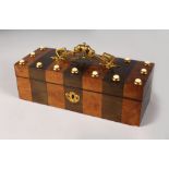 A 19TH CENTURY TWO-COLOUR BOX AND COVER with ivory mounts and ormolu handle. 10ins long.