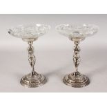 A GOOD PAIR OF CUT GLASS AND SILVER PLATED BONBON DISHES.