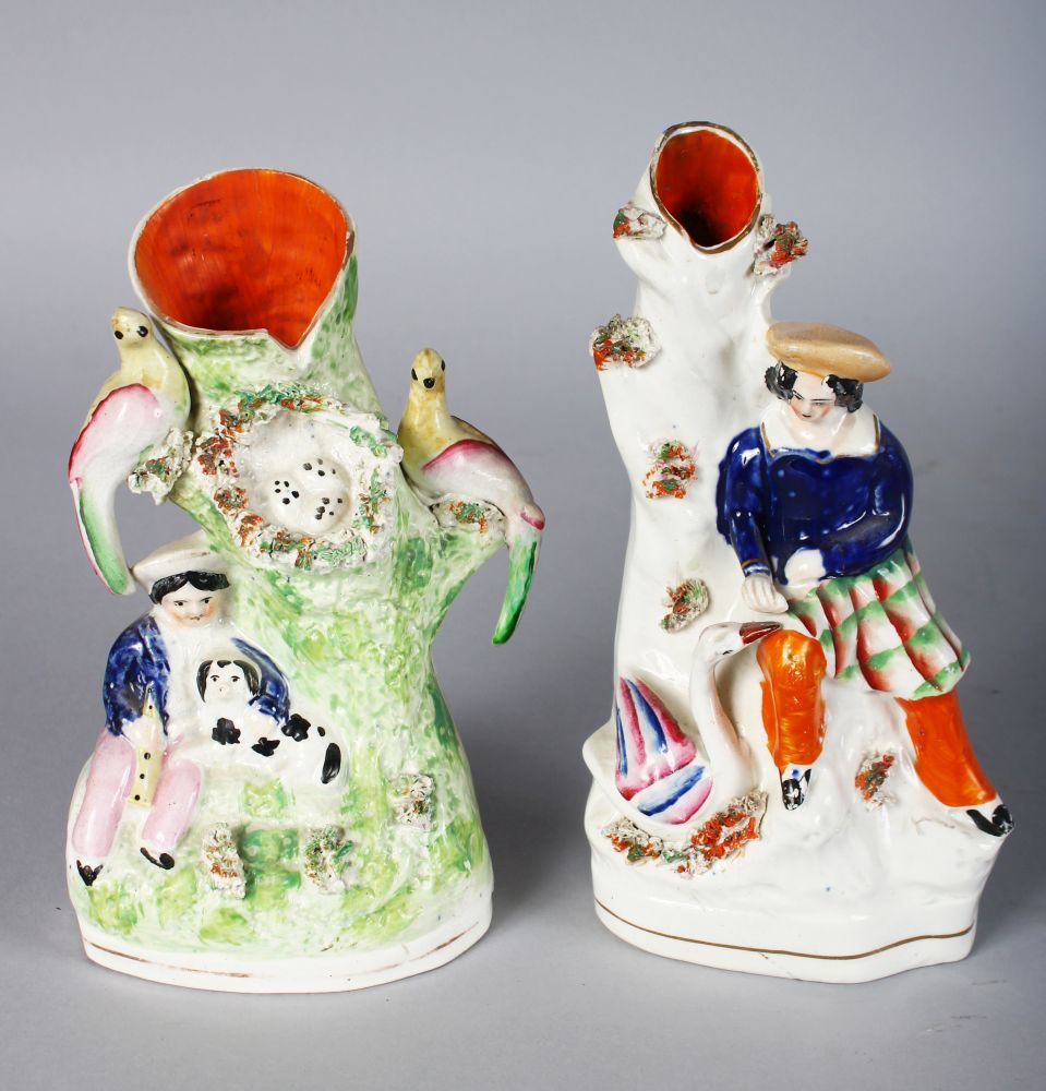 TWO STAFFORDSHIRE SPILL VASES, young Scottish girl with swan and Scottish boy with a dog (2). 7ins