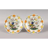 A PAIR OF POLYCHROME DUTCH DELFT PLATES, LATE 18TH CENTURY, boldly painted in yellow and orange with