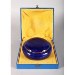 A SEVRES BLUE PORCELAIN BOWL AND COVER, in original box. 5ins diameter.