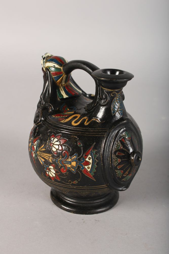 A CONTINENTAL POTTERY ISLAMIC DESIGN VASE AND JUG with female mask. 4.5ins high. - Image 2 of 4