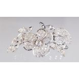 A WHITE GOLD IMPRESSIVE DIAMOND BROOCH set with over 100 diamonds.