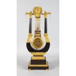 A SUPERB REGENCY LYRE SHAPED MYSTERY CLOCK, the top with a sunburst fruiting finial, curving