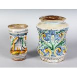 AN ITALIAN COLOURED POTTERY DRUG JAR, and a smaller drug jar. 8ins and 6ins high.