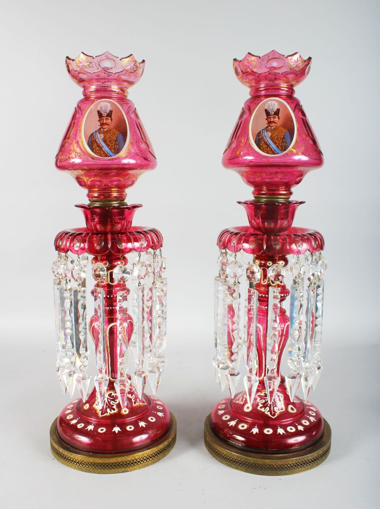 A SUPERB LARGE PAIR OF VICTORIAN BOHEMIAN RUBY GLASS LUSTRES, the domes gilded and painted with